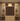 Wooden wine cabinet with wine bottles arranged in a grid pattern.