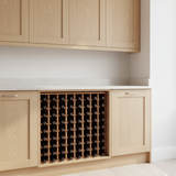 Wooden wine rack embedded in a kitchen cabinet with light wood finish.