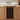 Wooden wine rack embedded in a kitchen cabinet with bottles inside.