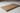 Wooden cutting board on a white surface