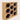 Wooden wine rack with honeycomb design holding bottles on a light beige background