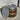 Wooden barrel with metal cap on a concrete surface