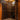 Wine cellar with wooden racks filled with wine bottles.
