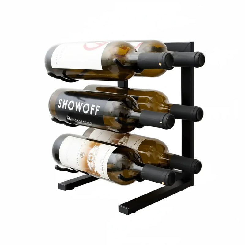 Black metal wine rack holding three bottles on a white background