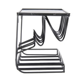 Modern black metal side table with a glass top on a white background