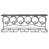 Decorative metal console table with circular designs on a white background