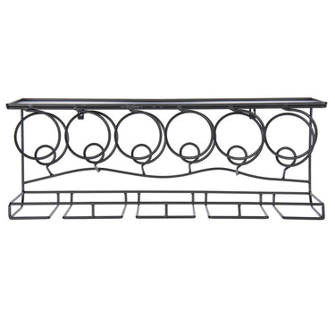 Decorative metal console table with circular designs on a white background