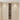 Wooden wine cabinet with embedded wine rack on a light wooden floor.