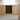 Wooden kitchen cabinet with built-in wine rack containing bottles.