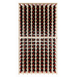 Wooden wine rack with red wine bottles on a white background