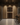 Modern wine cellar with wooden wine rack and bar area.