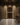 Modern wine cellar with wooden wine rack and bar area.
