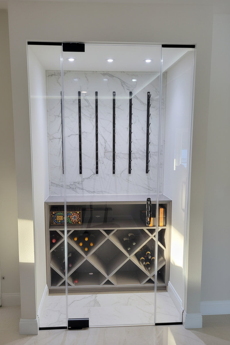 Modern wine cellar with glass door and wine rack.