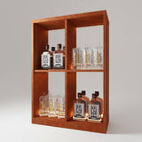Wooden shelf with illuminated bottles and glasses on a gray background