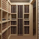 Wine cellar with wooden shelves filled with wine bottles.
