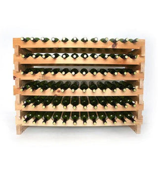 Wooden wine rack with multiple bottles of wine on a white background