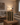 Wine rack with bottles on a table in a living room setting
