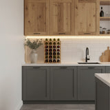Modern kitchen with wooden and gray cabinets, wine rack, and sink.