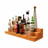 Wooden shelf with various bottles on a white background