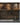 Wooden shelf with books, bottles, and a decorative poster in a kitchen setting.
