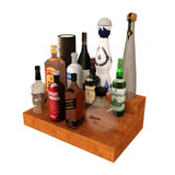 Collection of various alcohol bottles on a wooden shelf with a white background