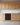 Wooden kitchen cabinets with a built-in wine rack.