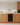 Wooden kitchen cabinets with a built-in wine rack.