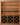 Wooden wine rack with shelves holding wine bottles and glasses.
