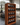Wooden wine rack with bottles on a white background
