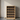 Wooden wine rack with bottles against a neutral wall