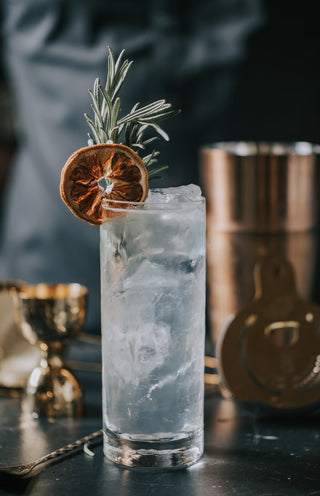 Lifestyle Image of Artisan Hand-Blown Highball Cocktail Glass