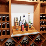 Wooden wine rack with various bottles including Johnnie Walker and Diageo products.