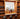 Wooden wine rack with various bottles including Johnnie Walker and Diageo products.