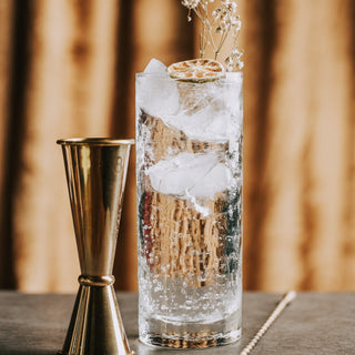 Lifestyle Image of Artisan Hand-Blown Highball Cocktail Glass