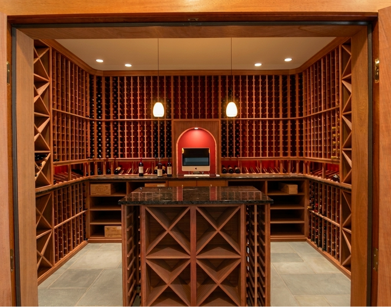 Wooden wine cellar with shelves and a bar area.