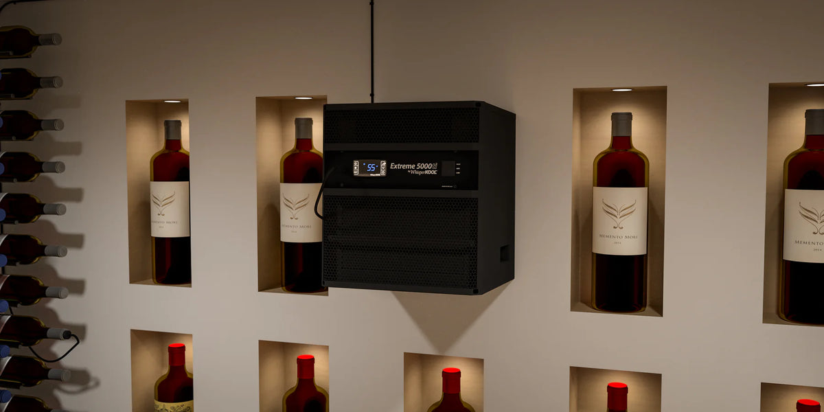Wine bottles displayed in a modern wine cellar with a digital temperature control unit.