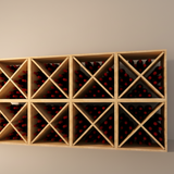 Wooden wine rack with bottles against a plain wall