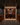 Wine cellar with wooden shelves and bottles, dimly lit.