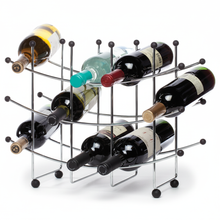 Metal wine rack holding several bottles of wine on a white background