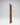 Wooden wine rack with multiple shelves on a gray background