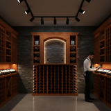 Man in a wine cellar examining bottles