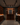 Man in a wine cellar examining bottles