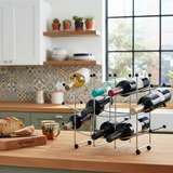 Wine rack with bottles on a kitchen counter with a window view