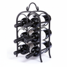 Black metal wine rack holding six bottles on a white background