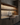 Modern kitchen with wooden cabinets, a sink, and glass shelves.