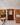 Wine cellar with wooden shelves and a reception desk.