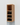 Wooden wine rack with bottles on a light gray background