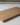 Wooden cutting board on a white surface