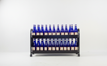 Metal bottle rack with multiple blue bottles on a white background