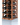 Wooden wine rack with bottles on a white background